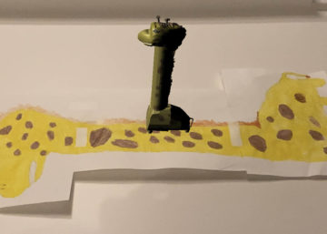 Augmented Reality Giraffe on kids drawing of same Giraffe.